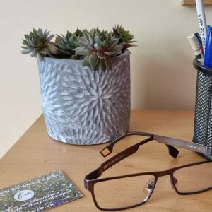 grey pot on desk